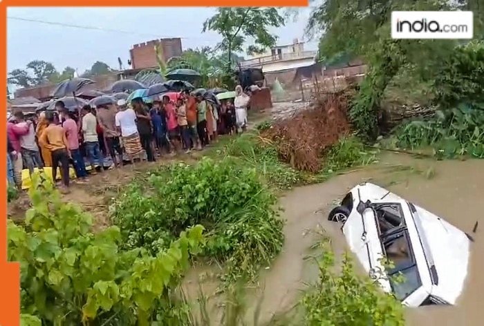 People-stand-near-the-Saryu-canal-after-an-SUV-fell-in-the-canal-leaving-at-least-11-people-dead-and-four-others-critically-injured-in-Gonda-district-Uttar-Pradesh-Sunday-Image-PTI.png